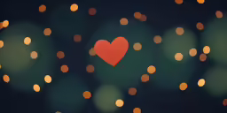 a bright red heart surrounded by lights