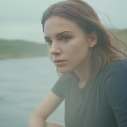 a close up of a person by the water