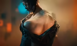 a woman with a wet dress looks off in the distance