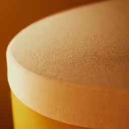 there is a yellow drum that is under the table
