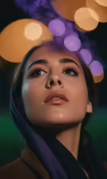 the woman has dark brown eyes and purple and yellow makeup