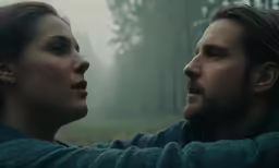a man and a woman sitting side by side