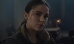 the girl looks at something while looking away