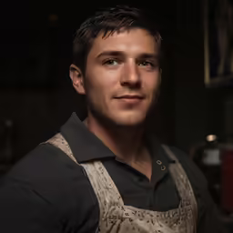 a close up of a person wearing an apron