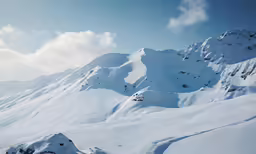 there are several snow capped mountains in the distance