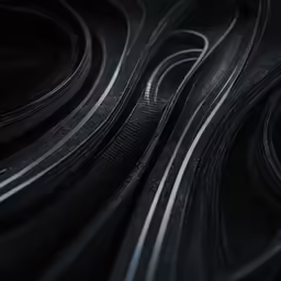 a group of black and white lines on some black and white material
