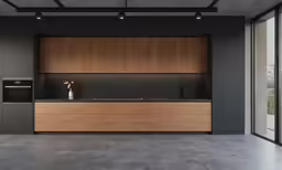 a modern looking kitchen with wooden cabinets and counter space