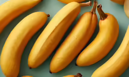 several ripe bananas sitting on top of a table