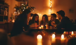 a group of people sitting at a table in a restaurant