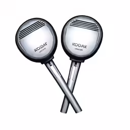 two chrome colored round mirrors sitting next to each other