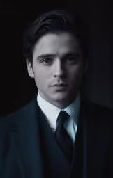 a person in a suit posing for a photograph