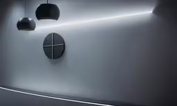 a couple of lights that are on the side of a wall