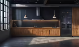 a large open kitchen with wooden cabinets and hanging lights