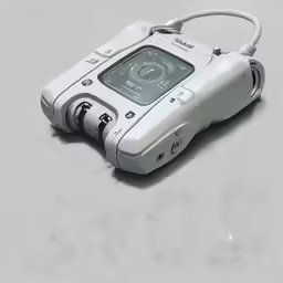 an old computer with a cord on top