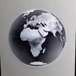 a metal globe with the world in white