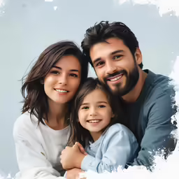 a smiling couple and their daughter hugging