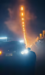 the back view of a car on the road at night