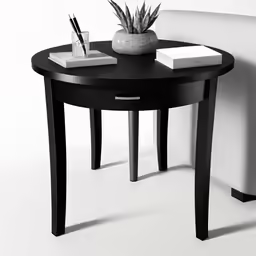 the corner table with writing implements is on the corner