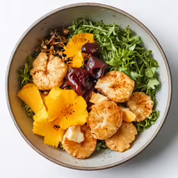 a bowl filled with lots of fruits and veggies