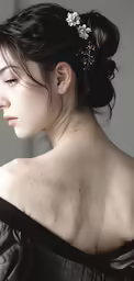 woman in dress with hair comb under shoulders