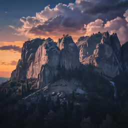 a group of mountains are shown during a sunset