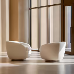 a couple of modern looking chairs in a big room