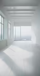 an empty white room with windows overlooking city view