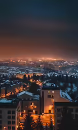 a city night view showing rooftop lights and buildings