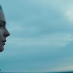 woman looking out to the distance on an airplane