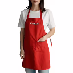 a woman in an apron holding a white and red chef