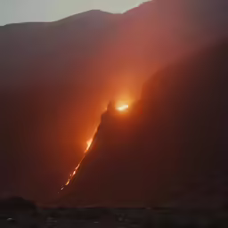 lightening on the mountain slopes near a city