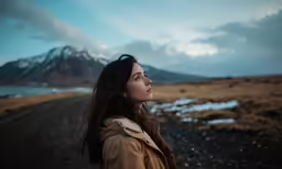 the woman is looking to something she is about to hear