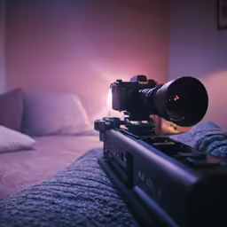 a camera set up on the bed to take a photo