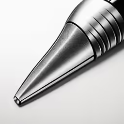 a small metal pen is on the surface