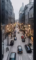 an empty city street at dusk as cars are stopped in traffic