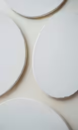 three different white plates sitting next to each other