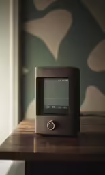 a clock on top of a wooden table