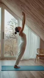 a person on a yoga mat in a room
