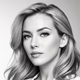 a woman with long blonde hair, posing for a black and white photo