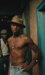 a person with no shirt posing for a photo