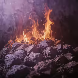 some rocks are being used to cook hot dogs