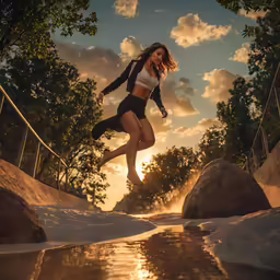 a girl running over water with the sun setting