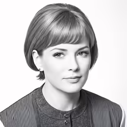 a young woman with short hair wearing a black and white photo