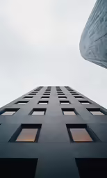 looking up at the top of a tall building