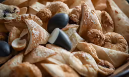 various types of croissants in a black bowl