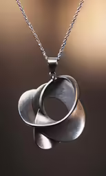 three rings on a chain are suspended in the air