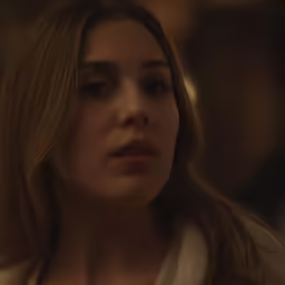 the blonde woman is wearing a white jacket