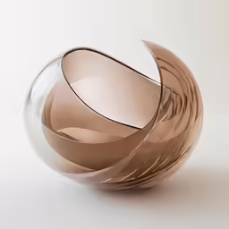 a brown vase is sitting on a white surface