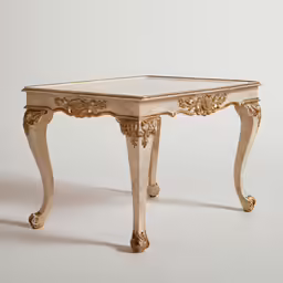 an intricately carved wooden table with golden trim