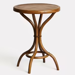 an oval wooden table with a circular shaped base